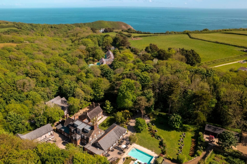 You’re looking at an aerial view of Stocks Hotel, a swimming pool, and plenty of trees. This is a unique boat-only-accessible dining location.  