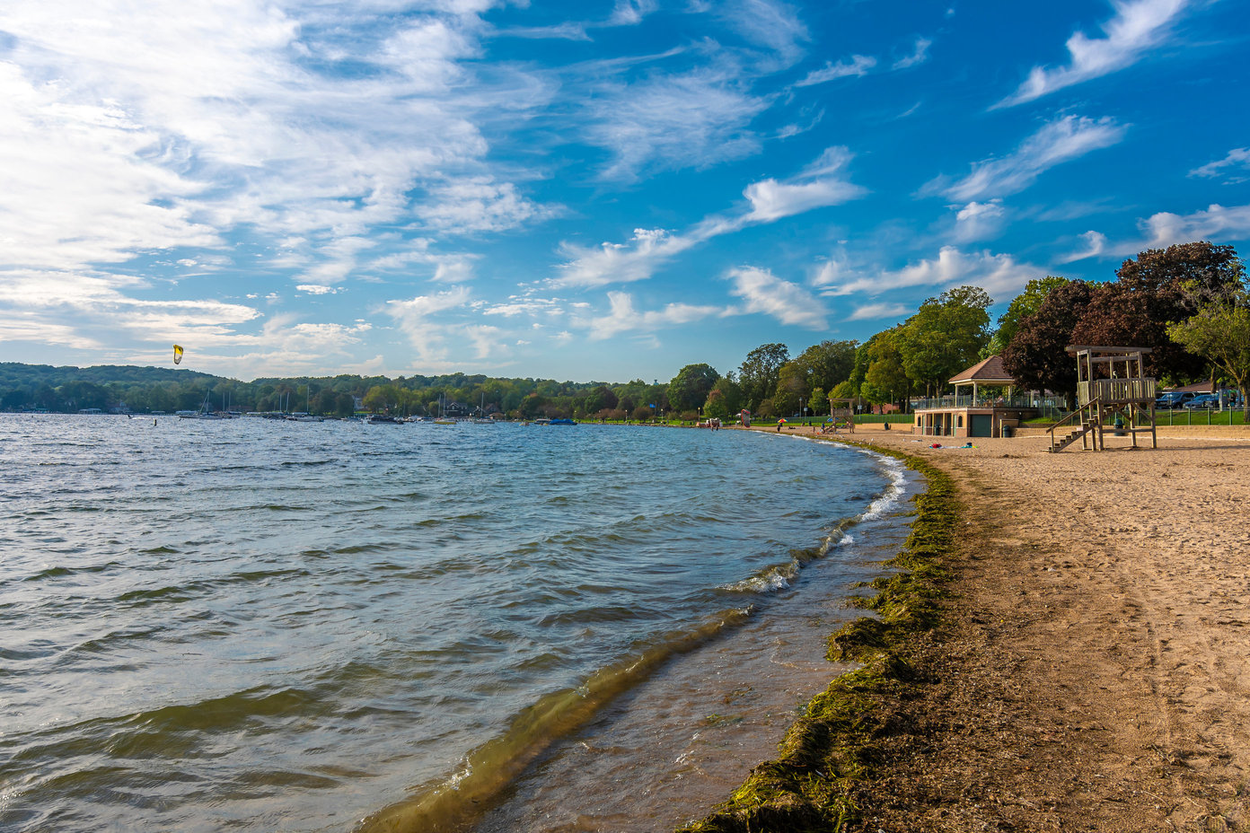 A view of a beach on Lake Geneva in Wisconsin on a clear day.