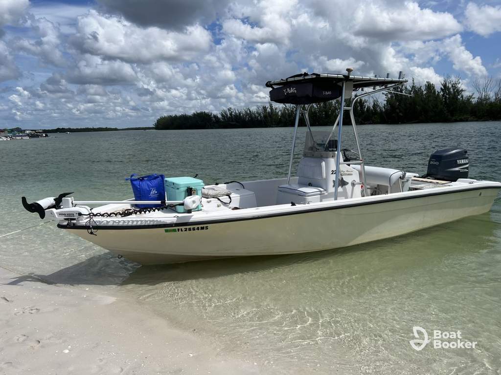 Center console charter boat at dock in Naples showing bow and console layout