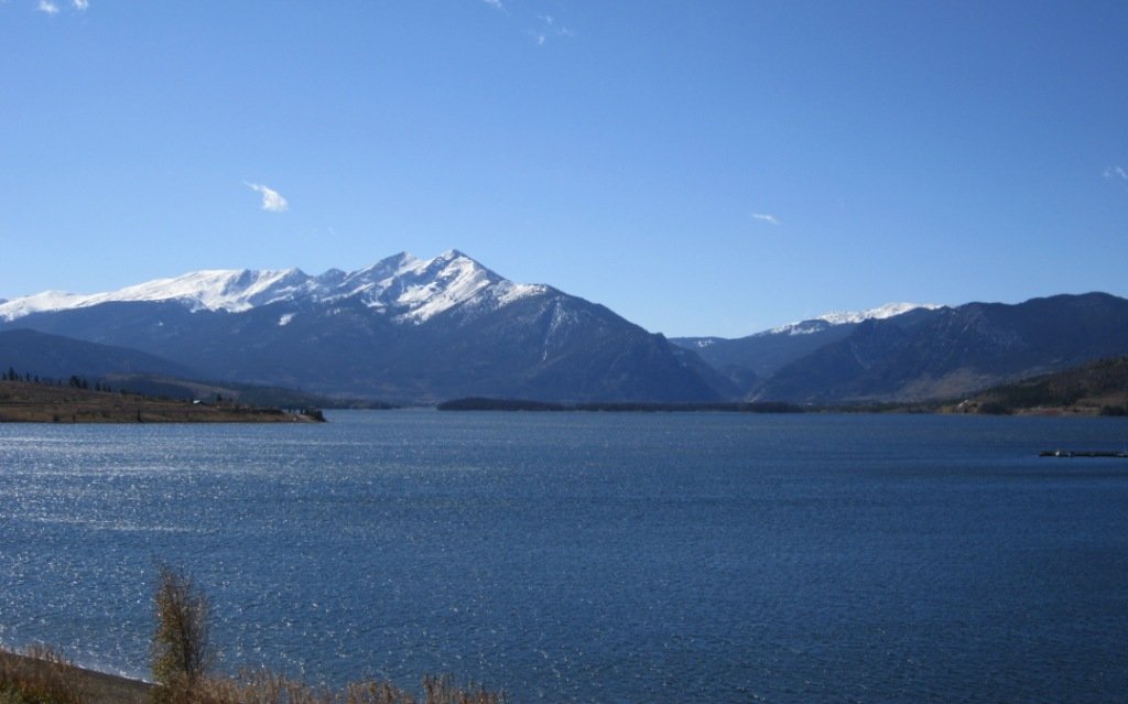 Dillon Reservoir with snow-capped Rocky Mountain peaks in autumn