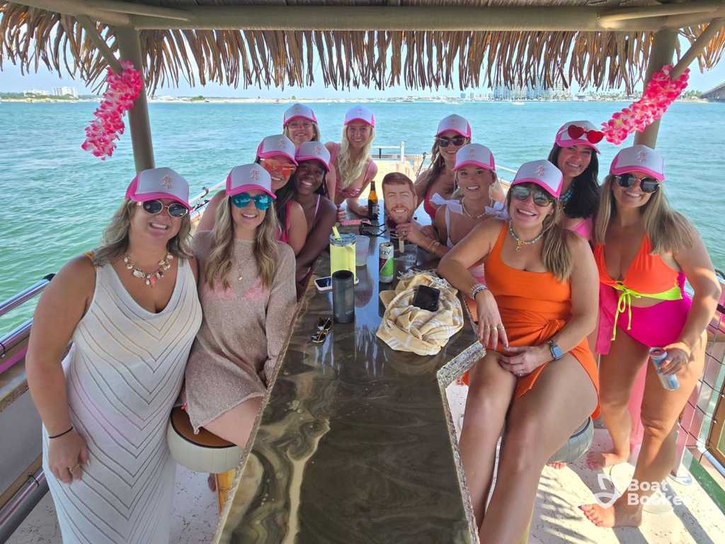 Tiki boat with passengers enjoying Alabama coastal waters