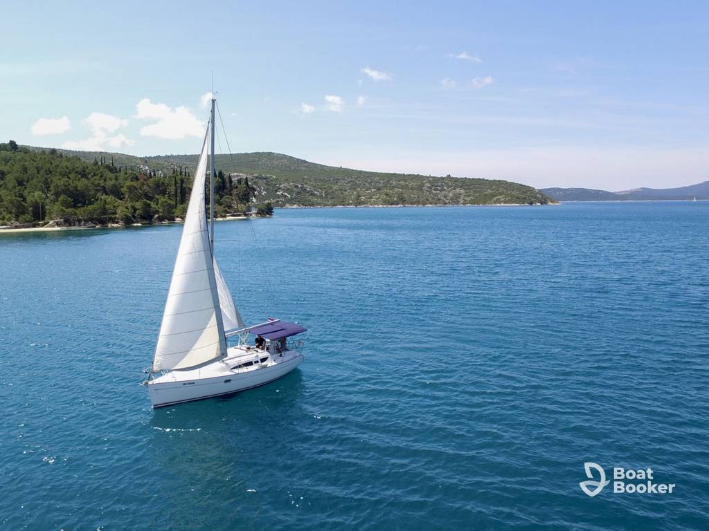 Sailboat anchored in a calm bay on the Croatian Adriatic