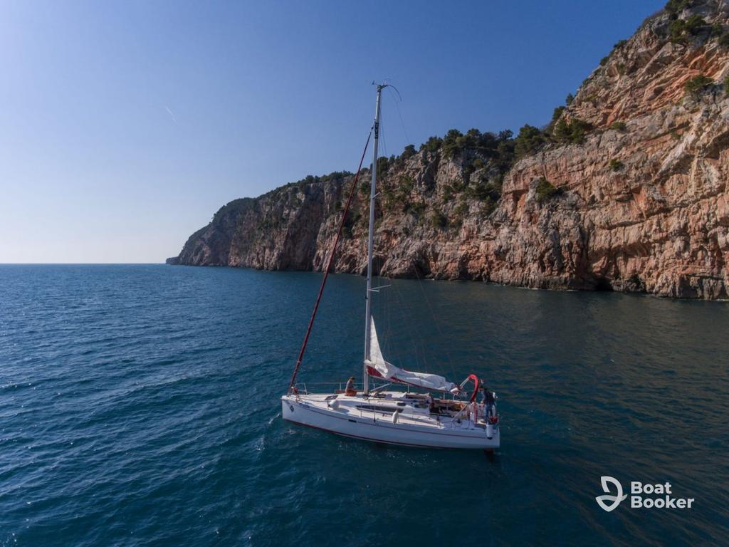 Sailboat near Dubrovnik old town walls on the Adriatic coast