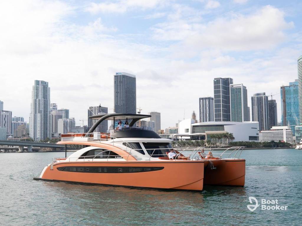 Charter yacht cruising on open water with clear blue skies